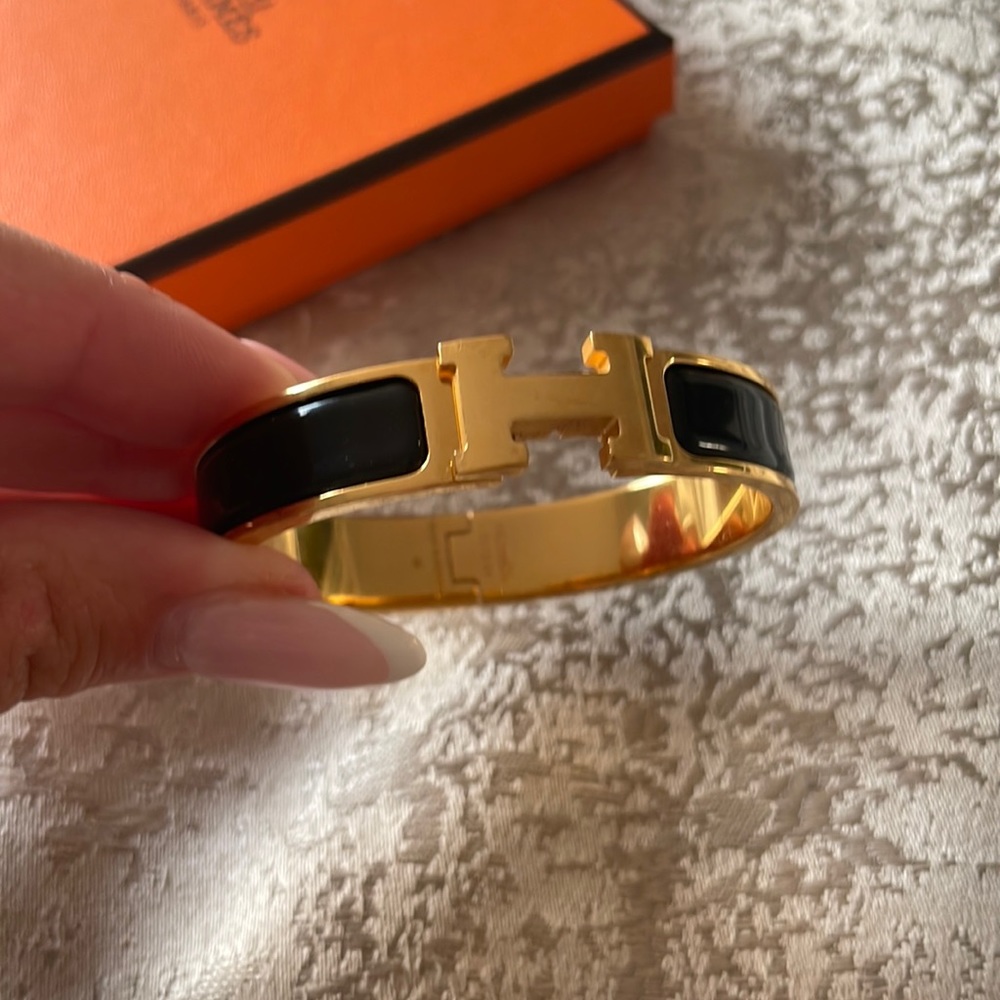 BLACK AND GOLD CLIC CLAC HERMES BANGLE